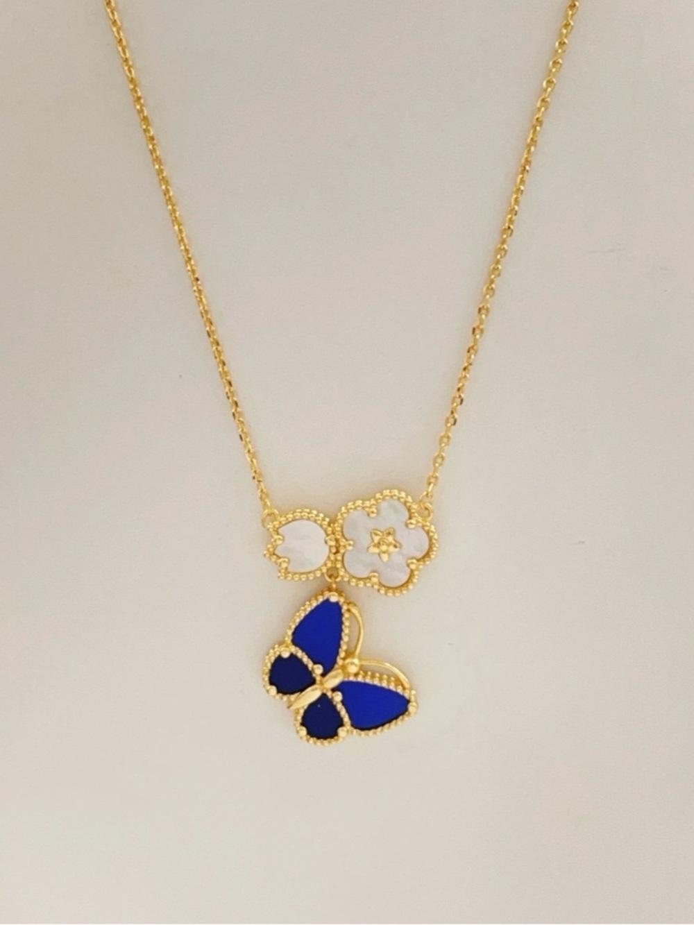 Van Cleef & Arpels Gold Necklace with Blue Butterfly and White Flowers